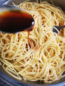 Add soy sauce to spaghetti