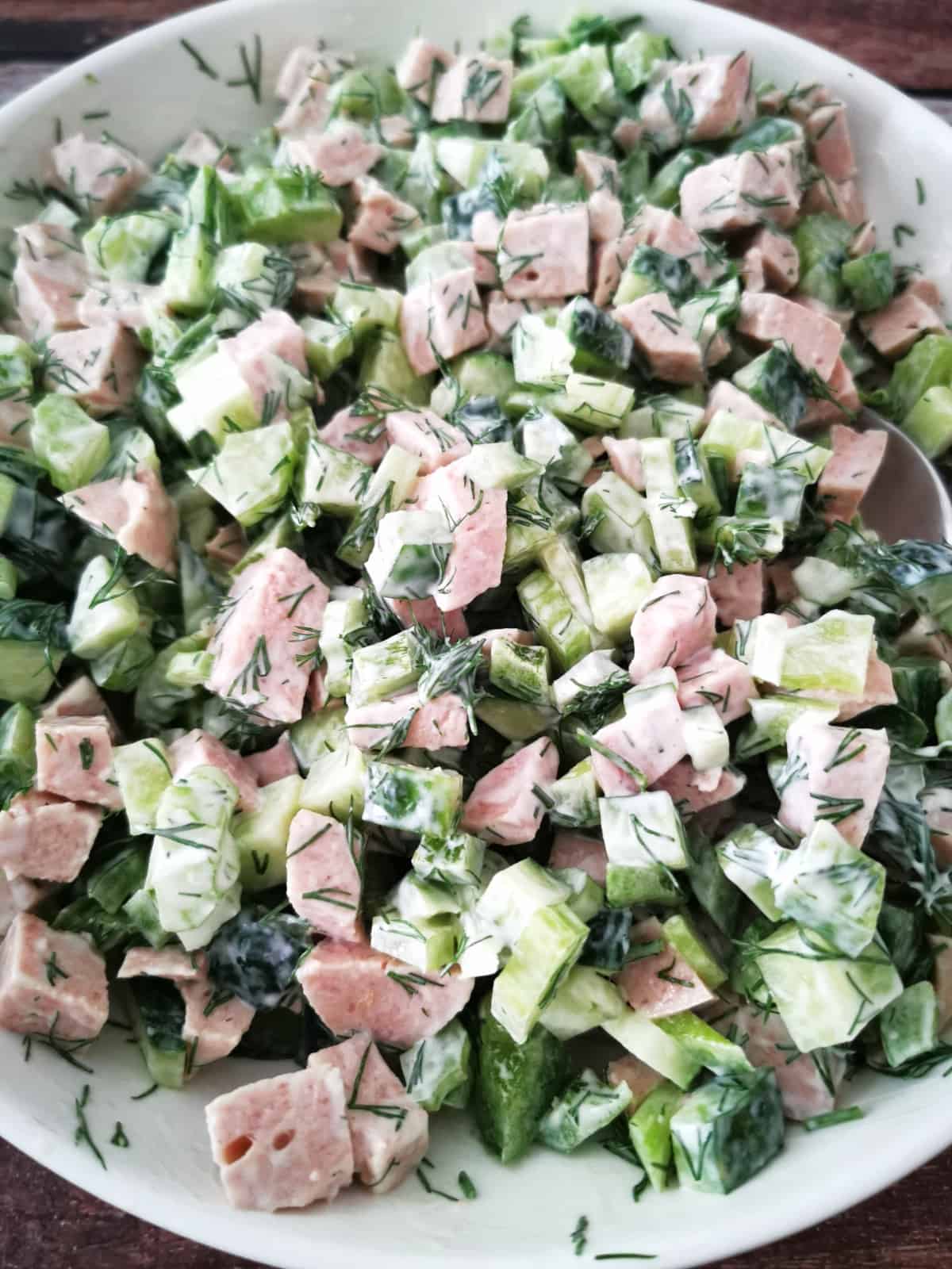 close up of all green salad wiwth ham