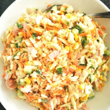 Cabbage and Ham Salad and white salad bowl