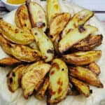 baked potato wedges in white plate.