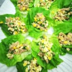 Tuna salad lettuce wraps on a large white serving platter.
