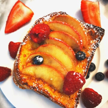 Apple Cinnamon French Toast with blueberries, strawberries and raspberries