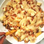 healthier oven-baked poutine on white serving plate
