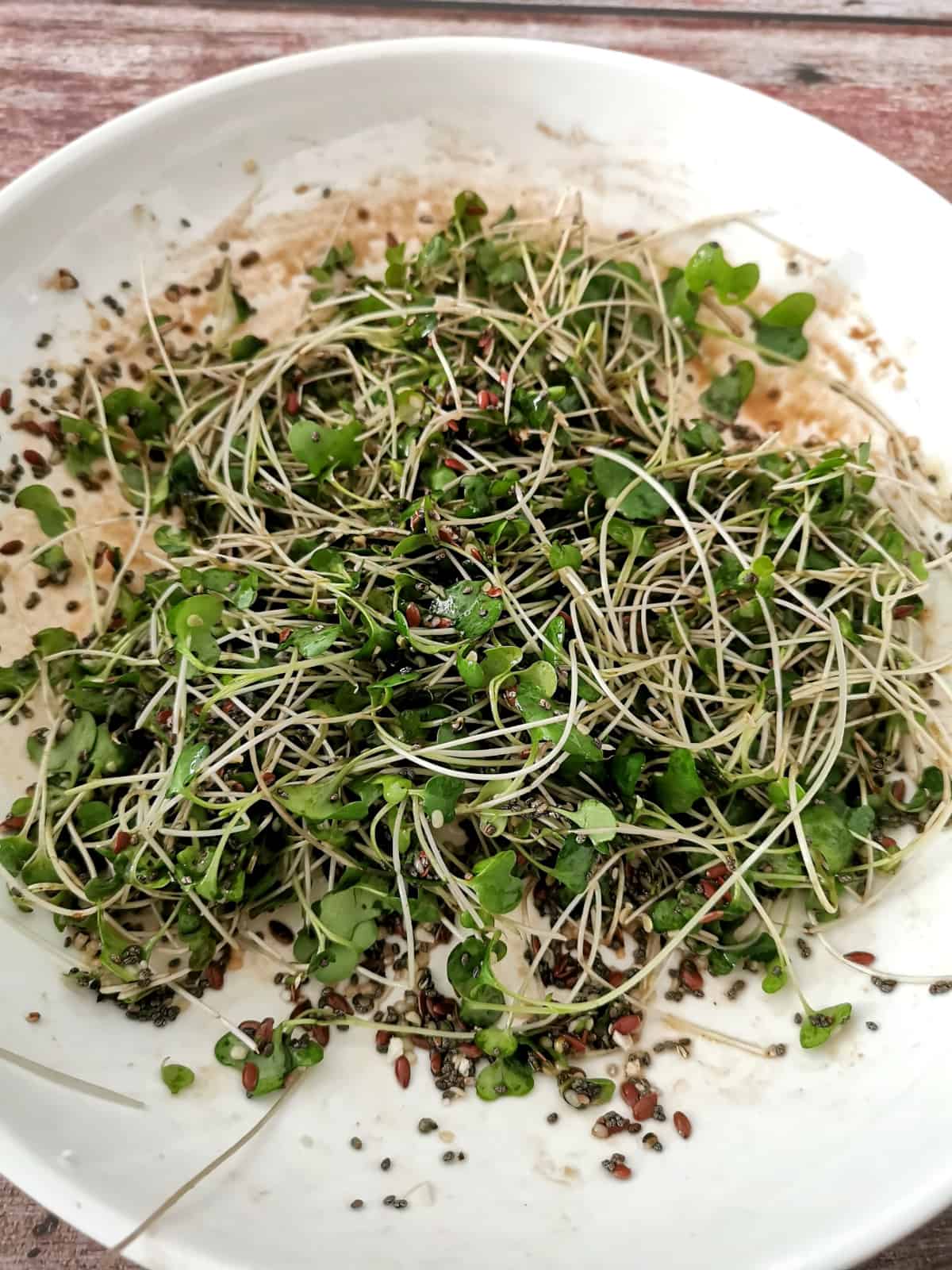 microgreens salad on white plate.