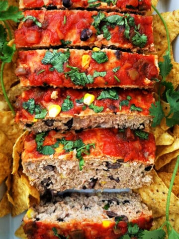 Mexican style meatloaf close up with cilantro and tortilla chips