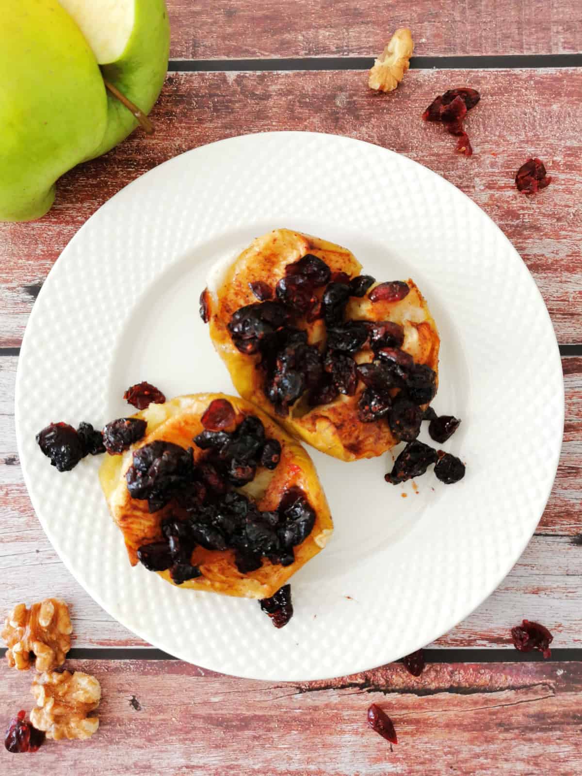 Maple Cinnamon Baked Apples on a small white plate.