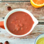 Cranberry Mustard Sauce in a red saucer.