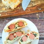 Puff pastry breakfast roulade in a small white plate.