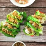 Crispy Onion Shrimp Lettuce Tacos in taco holders.