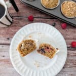 Coffee Cake Muffins cut in half and placed on a white serving plate.