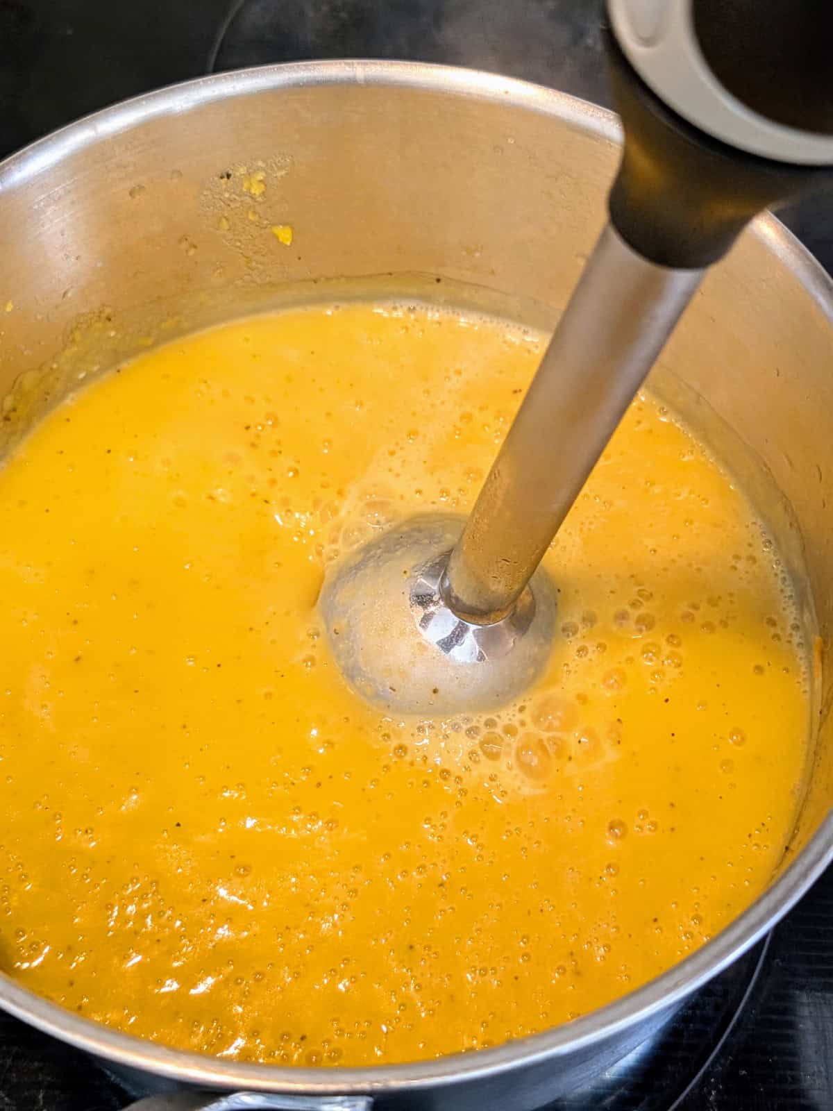 butternut squash sauce blended in pot.