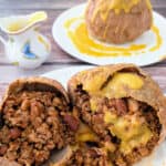 chili-filled meatball cut in half with butternut squash sauce poured on top.
