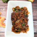 Slow Cooker Flank Steak with Papaya Marinade in a large white platter.