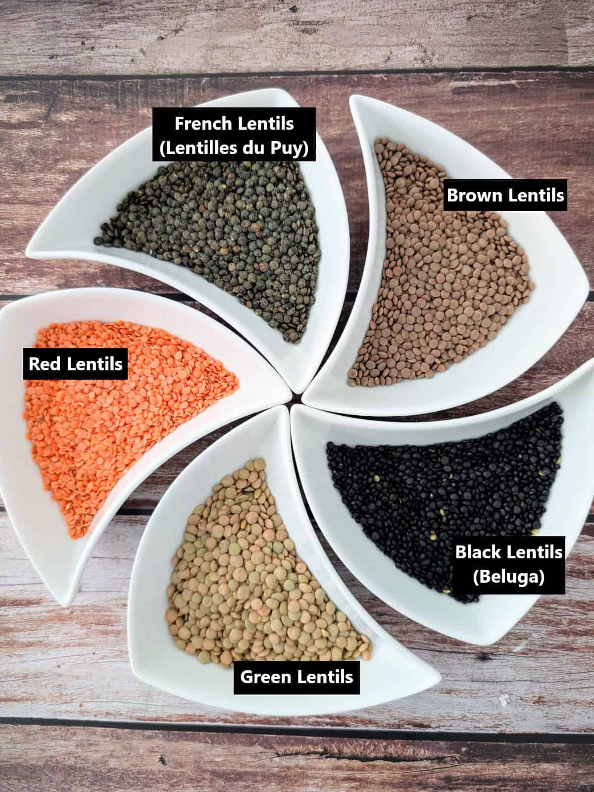 different types of lentils in separate plates, labeled.