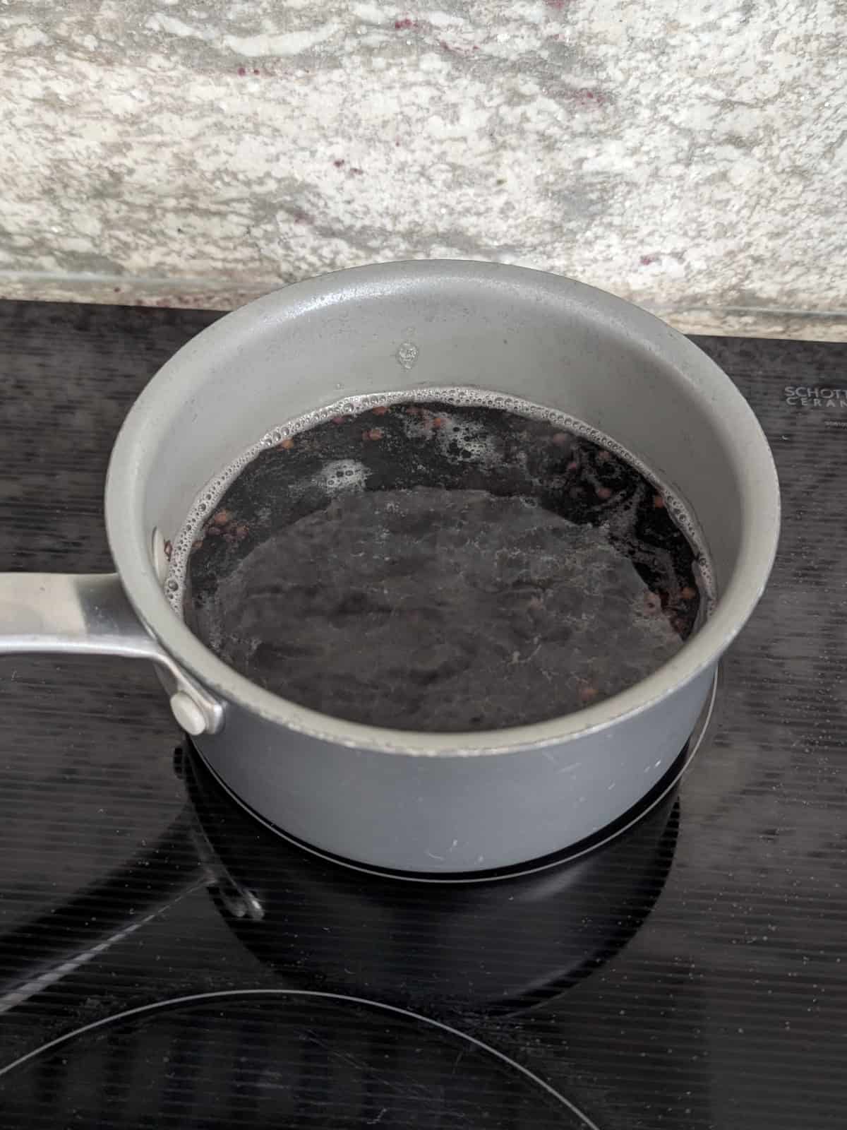 beluga lentils cooking a small saucepan.