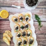 April Fool’s 'Caviar' Canapés on a white platter.