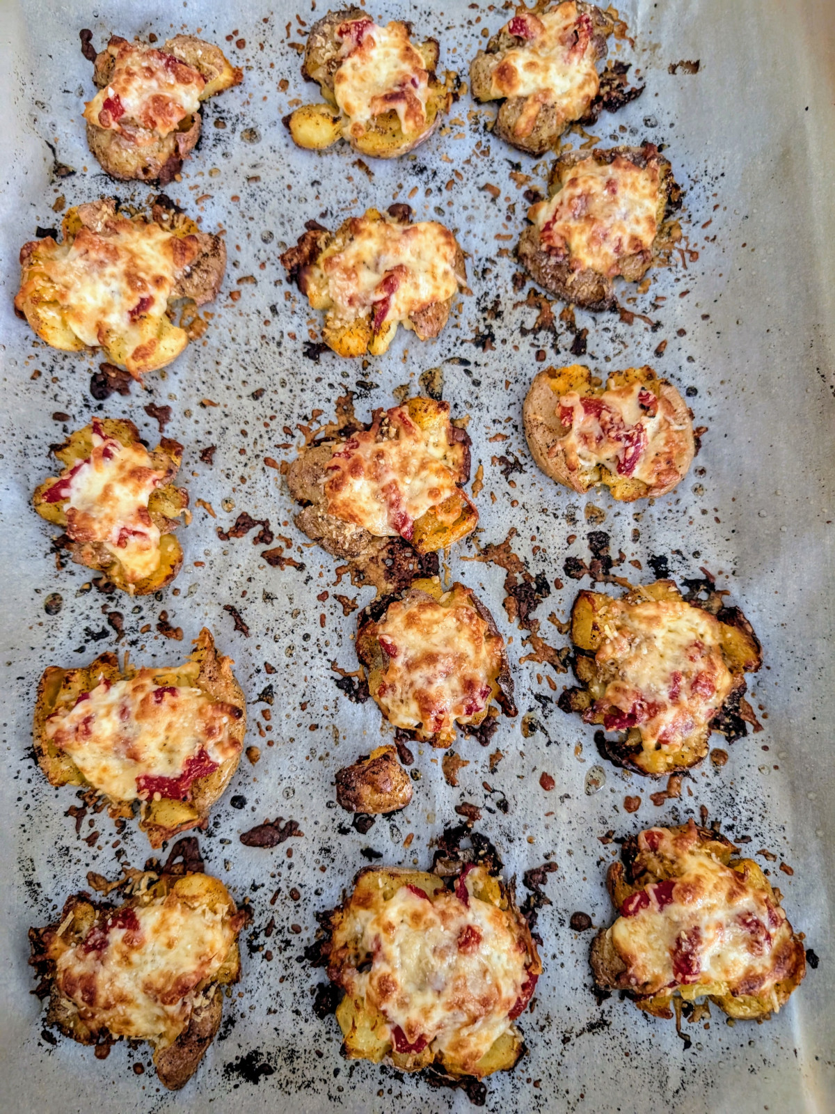 smashed potatoes topped with cheese and roasted red pepper.