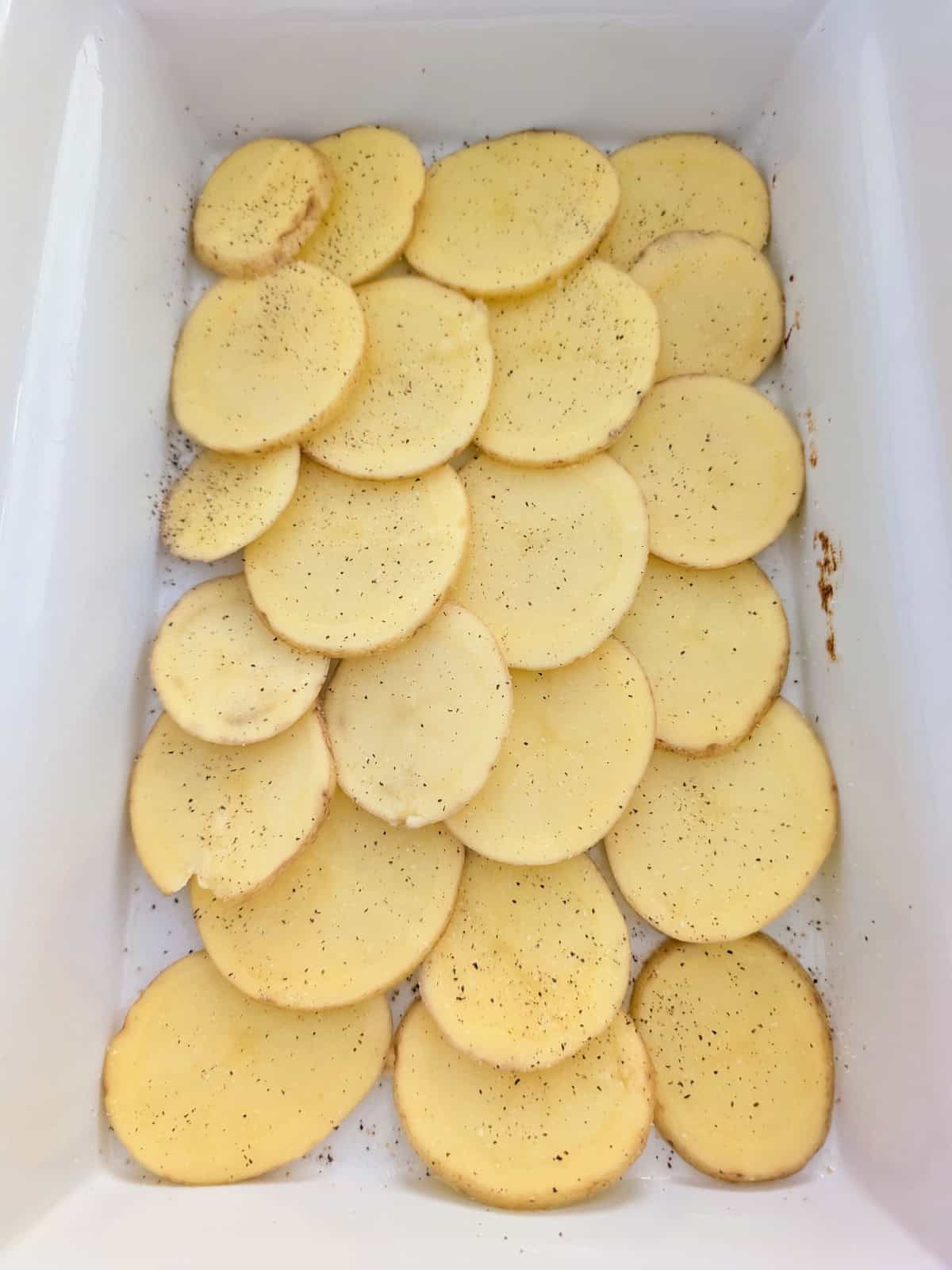 seasoned scalloped tomatoes in a casserole dish.