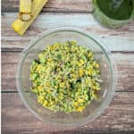 Pesto Orzo Salad with Grilled Corn in a large glass mixing bowl.