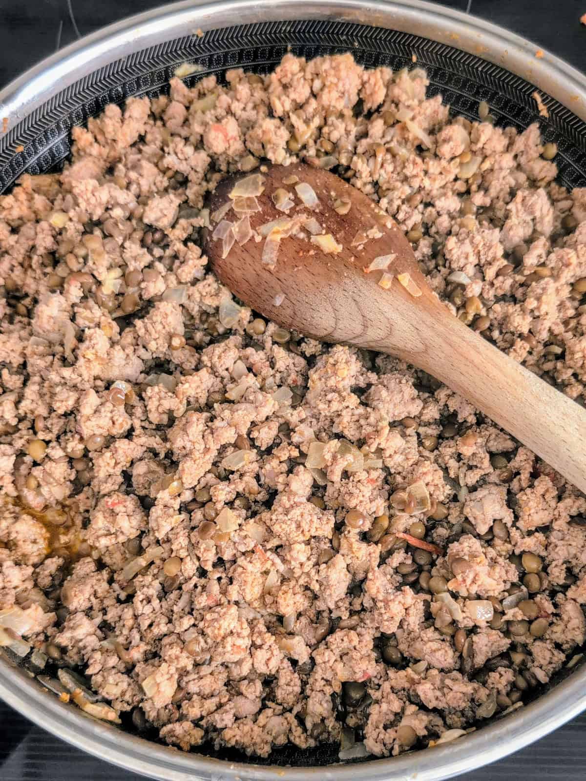 ground veal and beef filling for Swiss chard frying in a skillet.