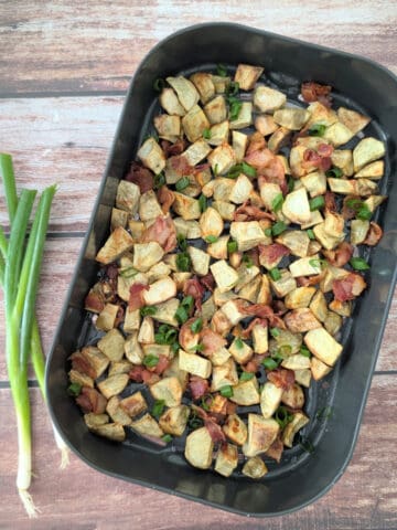 2-Ingredient Air Fryer Bacon Potatoes in an air-fryer tray.