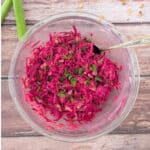 simple 5-ingredient beet sauerkraut salad in a large glass mixing bowl.