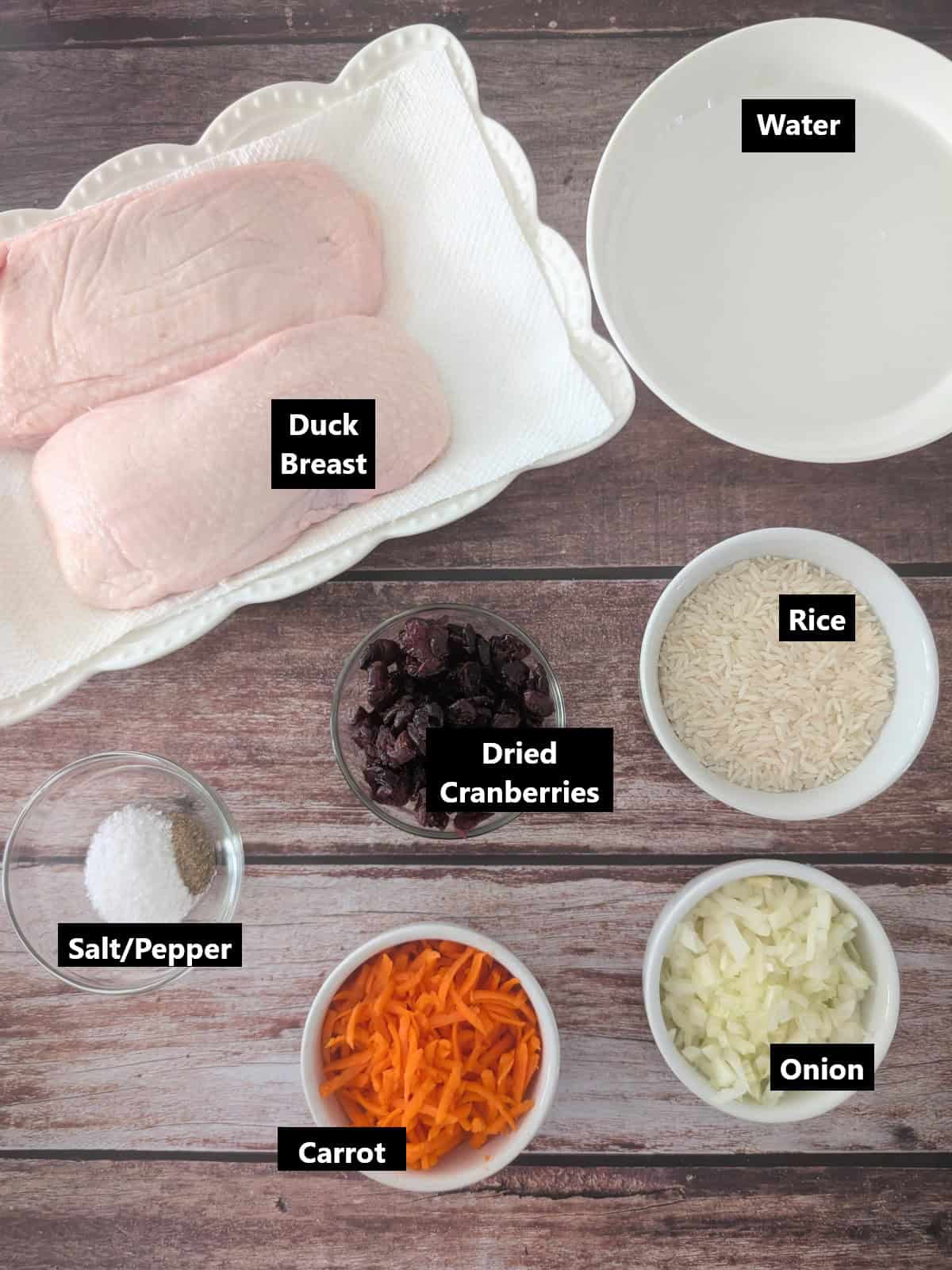 all ingredients of Seared Duck Breast with Cranberry Rice recipe labeled.