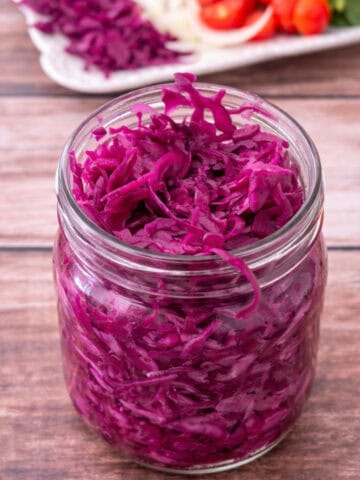 pickled red cabbage in a glass jar.