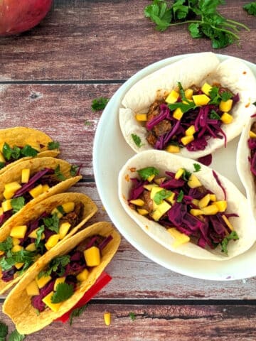 Leftover steak tacos with mango and pickled red cabbage in corn and flour tortillas.