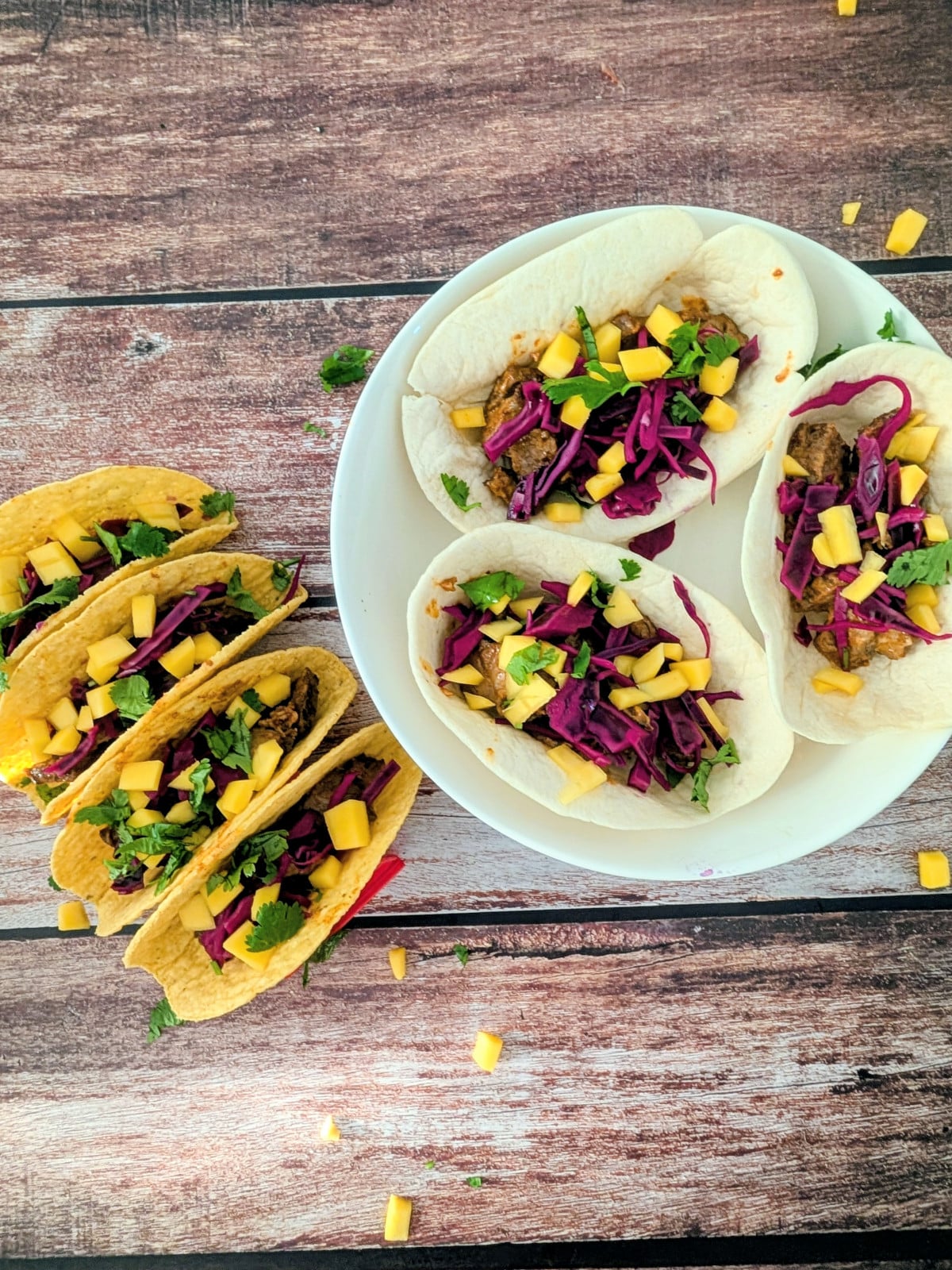 Spicy leftover steak tacos topped with pickled red cabbage, diced mango and fresh cilantro.