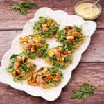 Leftover rice transformed into crispy rice rounds with fresh arugula, citrus, and halloumi.