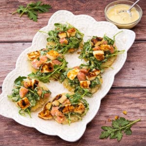 Leftover rice transformed into crispy rice rounds with fresh arugula, citrus, and halloumi.