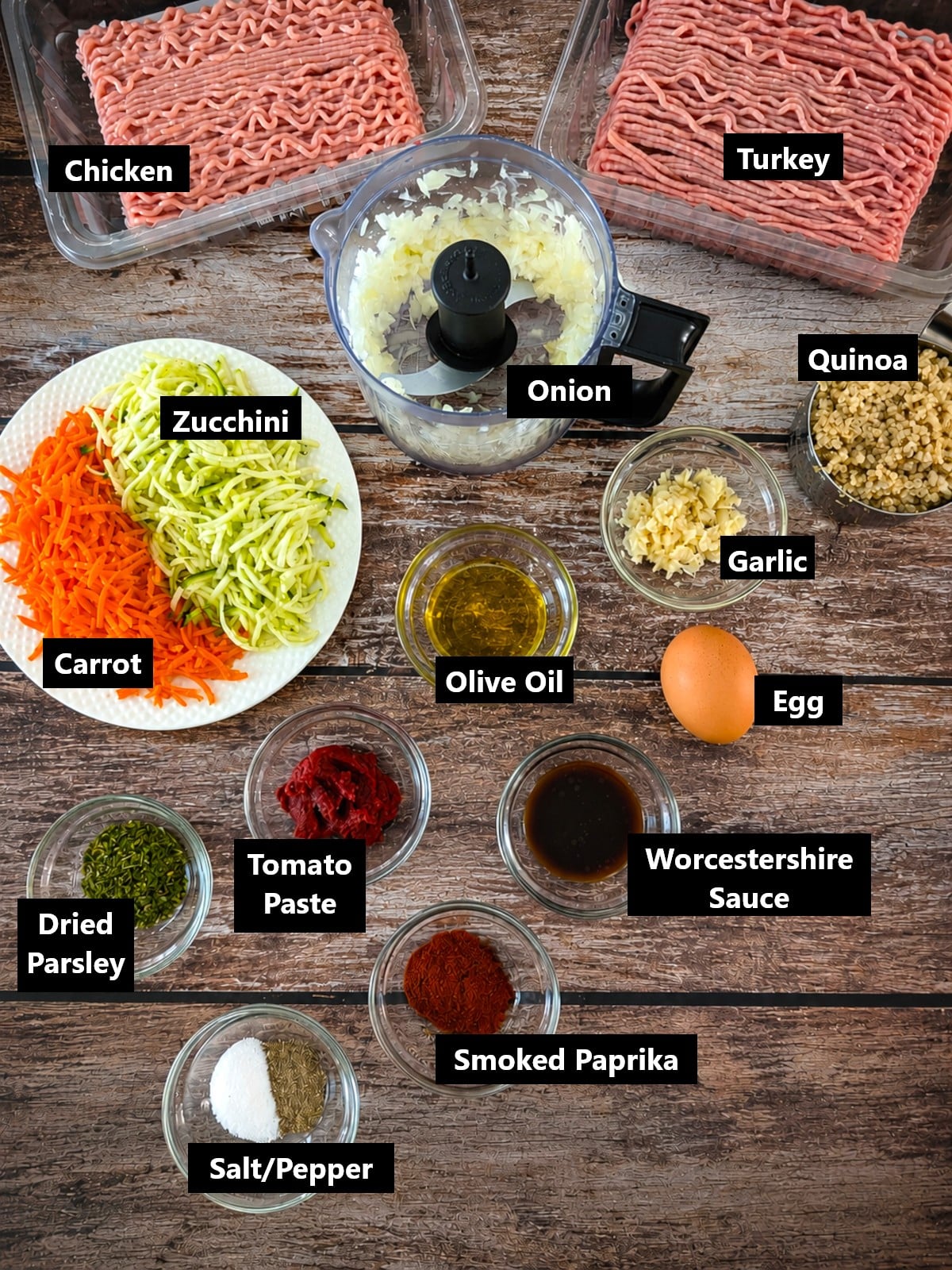 Ingredients for quinoa zucchini meatloaf including turkey, chicken, quinoa, carrots and zucchini.