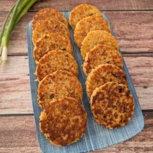 Crispy Rice Fritters served on a blue platter.